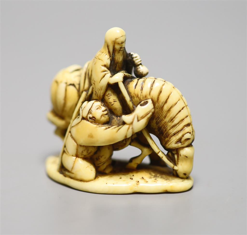 A 19th century ivory netsuke horse group, height 4cm, three character signature